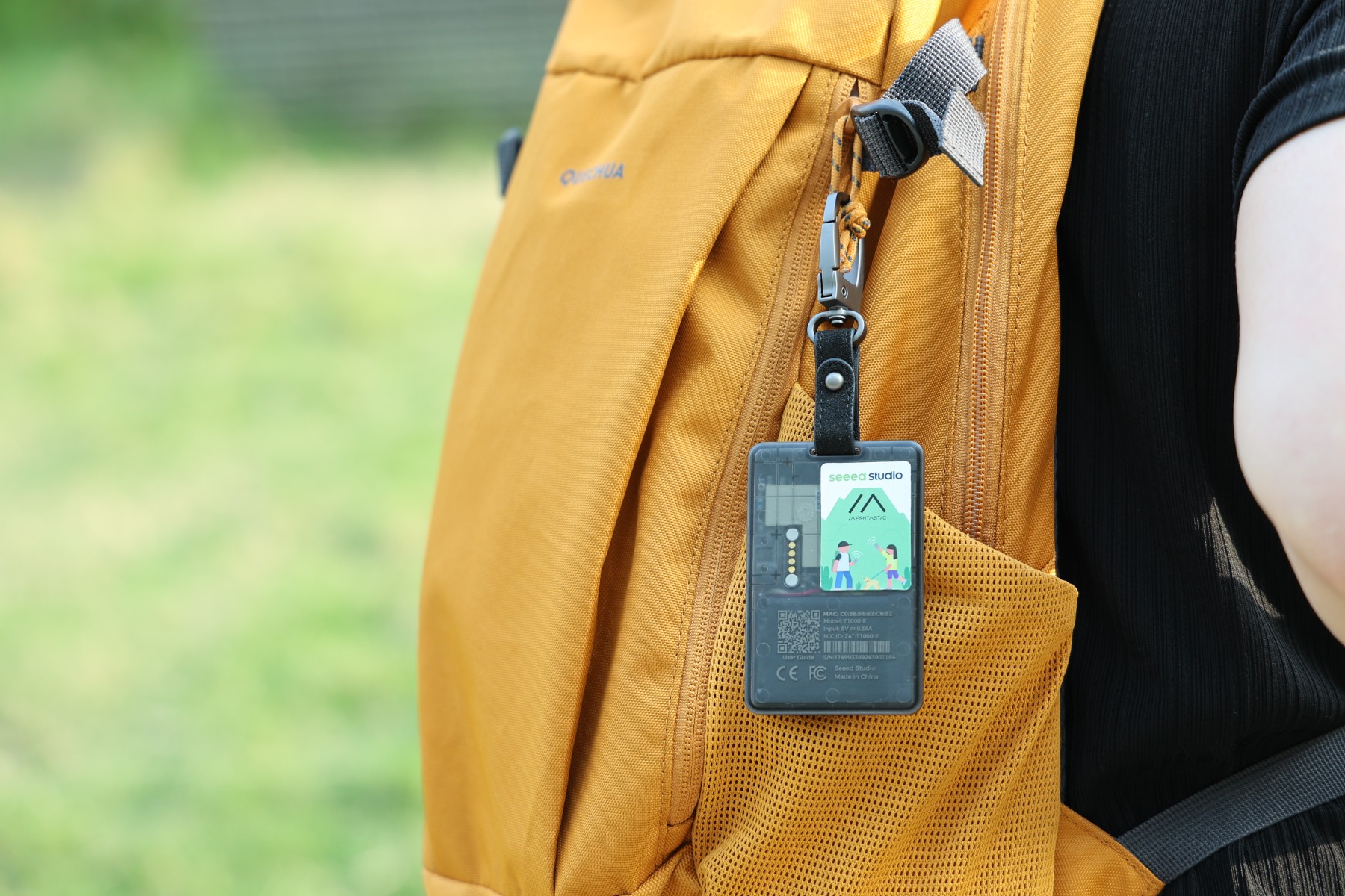 SenseCAP T1000-E clipped to a hiking backpack